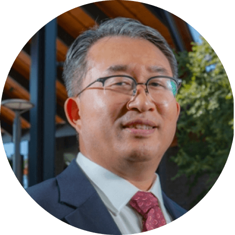 university professor wearing suit and tie with glasses presenting a professional look